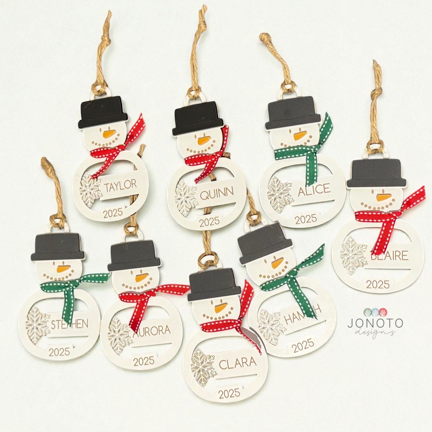 Set of personalized snowman Christmas ornaments with names and years on a white background