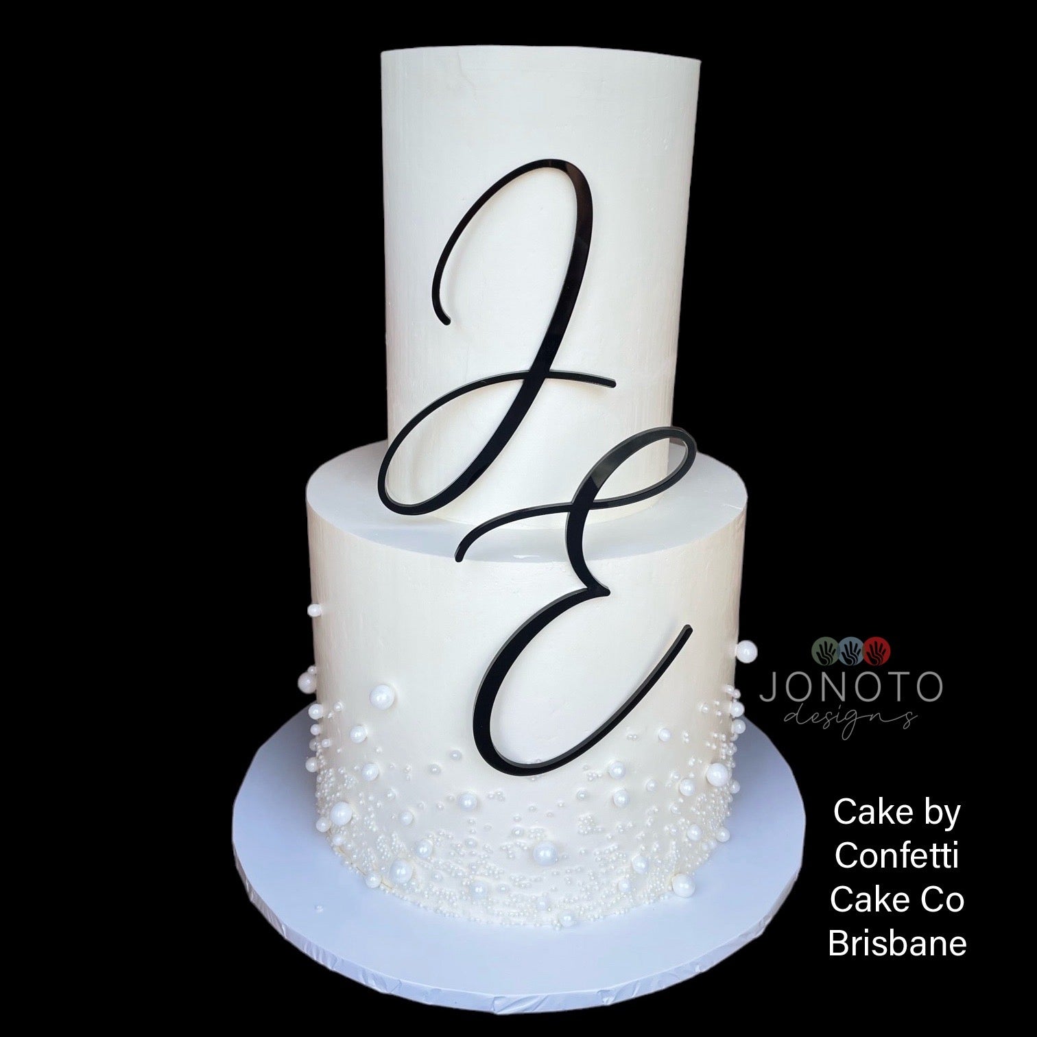 elegant wedding cake featuring large initials