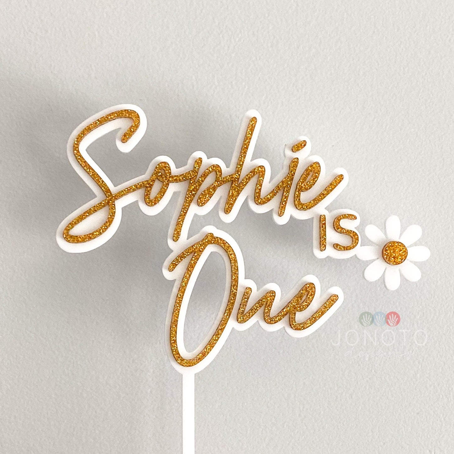 first birthday cake topper with daisy theme