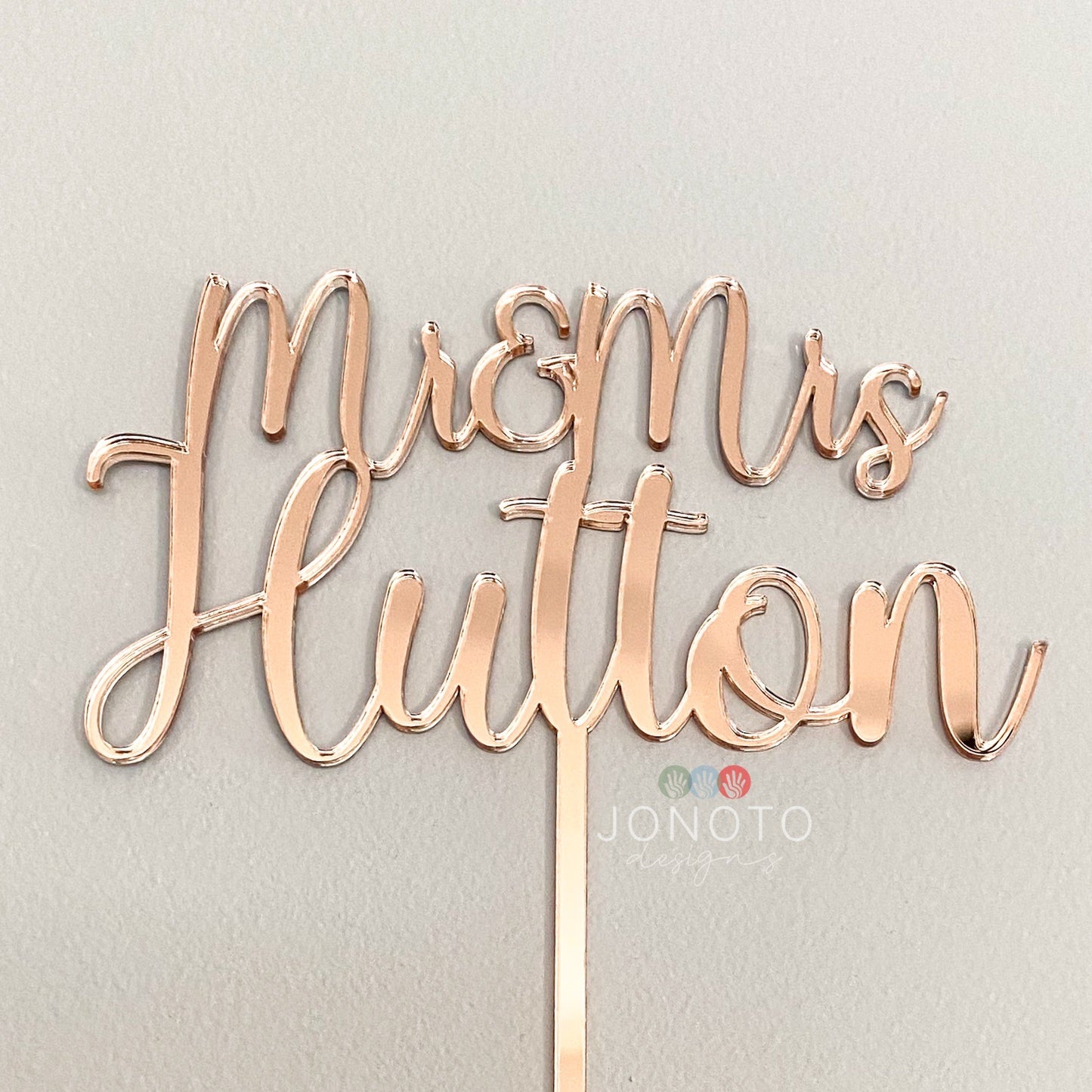 wedding cake topper featuring couples name