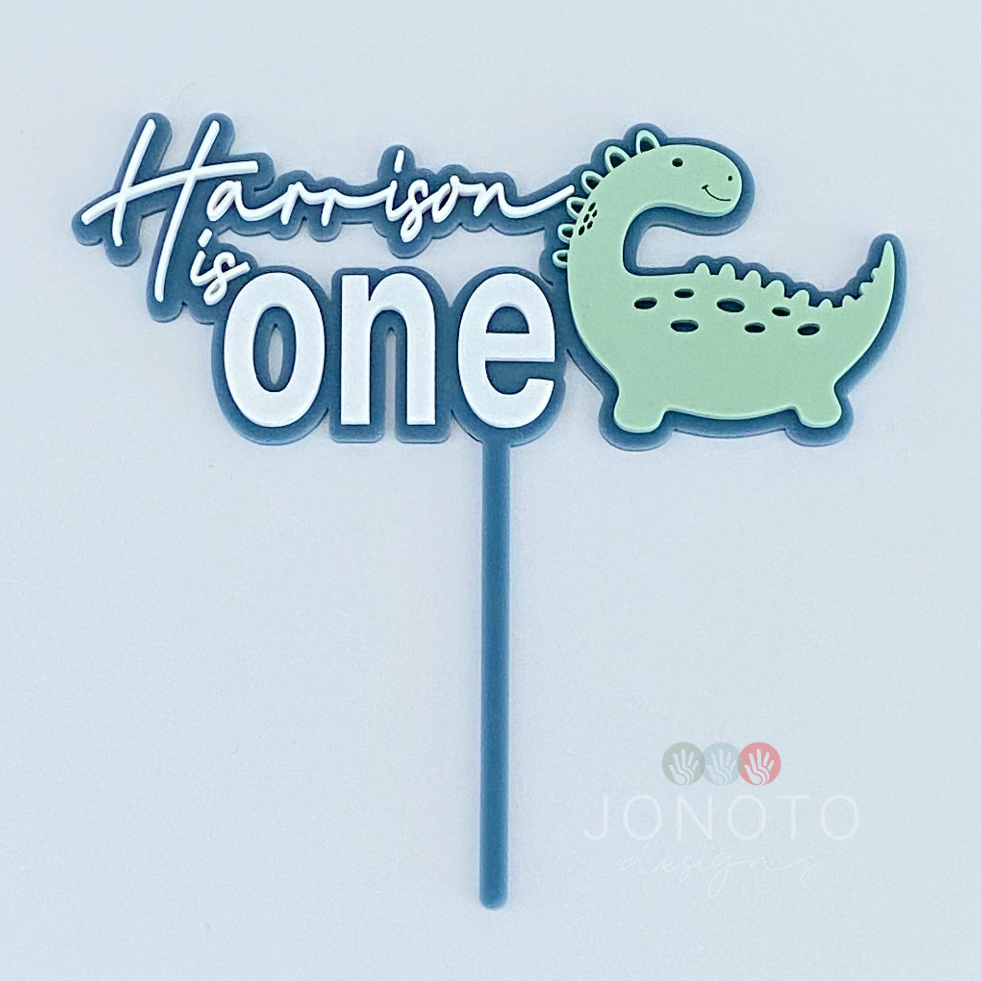 first birthday cake topper with dinosaur