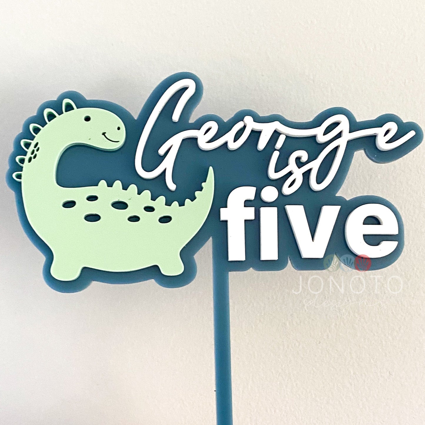 Dinosaur themed custom cake topper