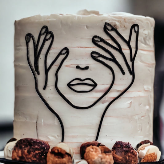 abstract face cake topper with modern design