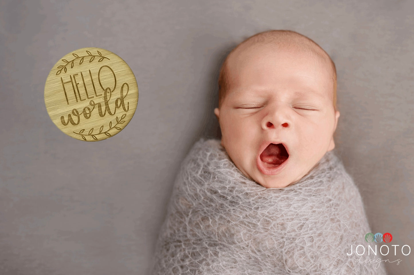 baby photo with hello world plaque
